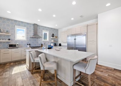 Atlantis, kitchen with table built into the island and a massive refrigerator